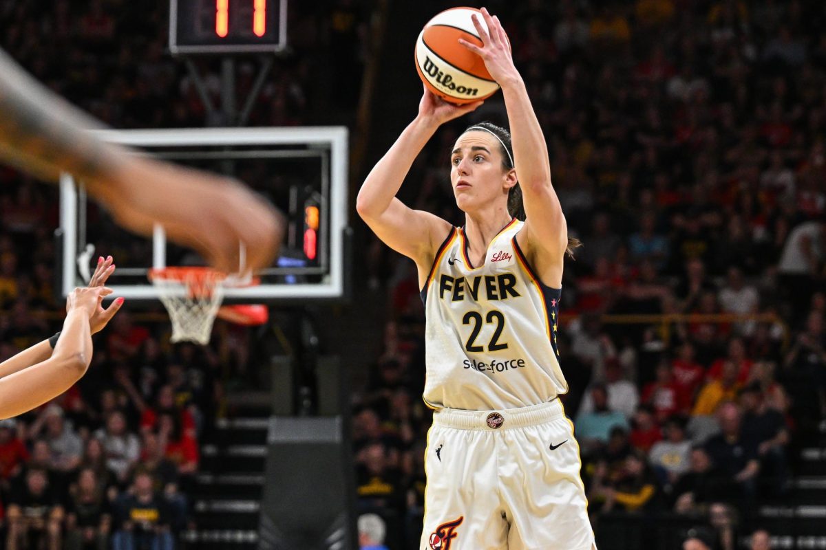 May 4, 2025; Iowa City, IA, USA; Indiana Fever guard Caitlin Clark (22) shoots a three point basket against the Brazil National Team during the third quarter at Carver-Haweye Arena. Mandatory Credit: Jeffrey Becker-Imagn Images