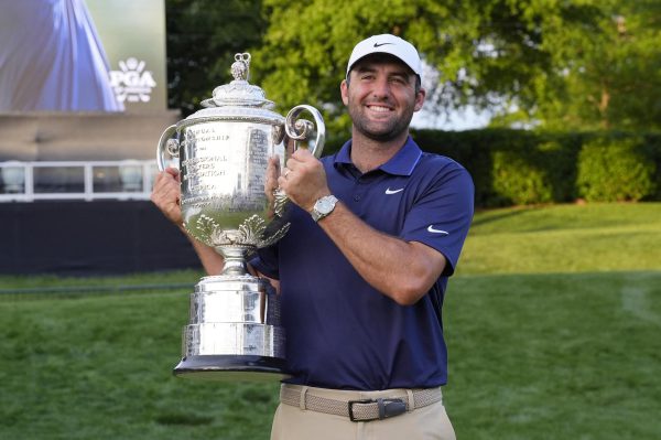 May 18, 2025; Charlotte, North Carolina, USA; Scottie Scheffler poses for a photo with the Wanamaker Trophy after winning the PGA Championship golf tournament at Quail Hollow. Mandatory Credit: Jim Dedmon-Imagn Images