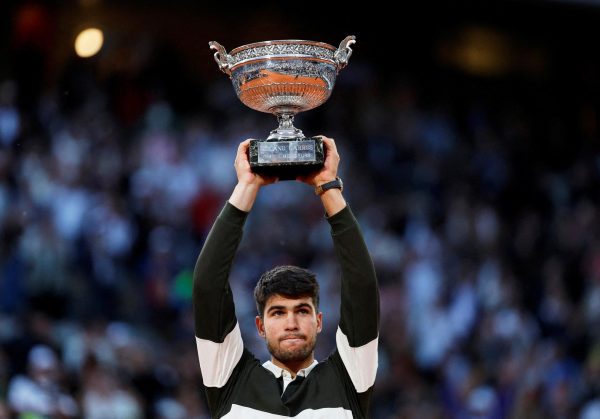 Tennis - French Open - Roland Garros, Paris, France - June 8, 2025 Spain's Carlos Alcaraz celebrates with the trophy after winning the men's singles final against Italy's Jannik Sinner REUTERS/Stephanie Lecocq