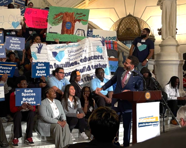 Contrell L. Armor, director of a statewide network for after-school programs, introduces youth advocates to the audience. 

