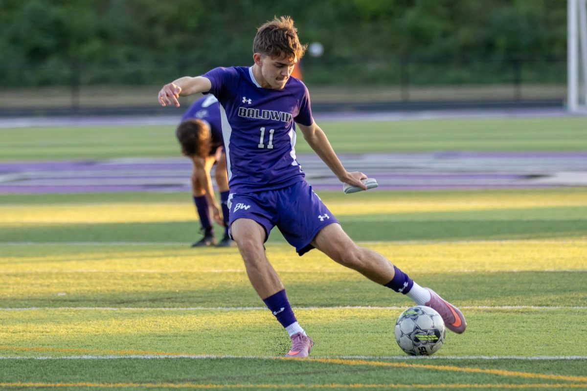 Sophomore Jacob Pearson shoots the ball during warmups against South Park.