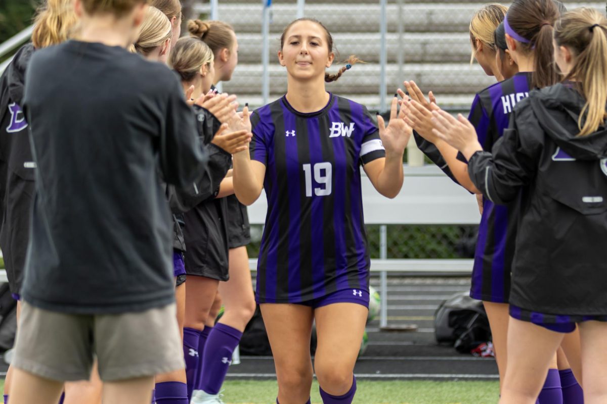 Senior Addison Hirt is introduced to the stadium against Mount Lebanon.
