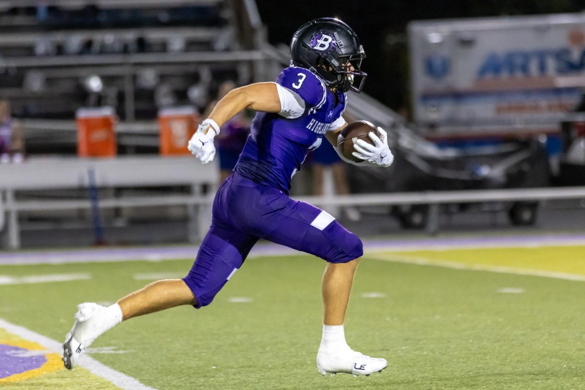 Senior Noah Saccani runs across mid-field towards the end zone for a touchdown against Chartiers Valley.