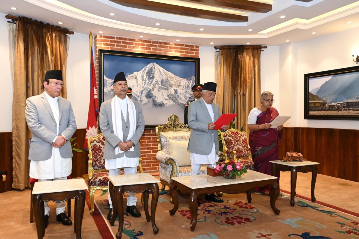 Nepal’s President Ramchandra Paudel administers the oath of office to Sushila Karki, a former Chief Justice, as Nepal’s interim prime minister during a swearing-in ceremony, following violent anti-graft protests, at the president's office in Kathmandu, Nepal, September 12, 2025. Nepal's President Office/Handout via REUTERS