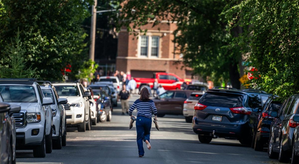 A mother runs toward the Annunciation Church to reach her son after hearing word of the shooting. Photo credit to Richard Tsong from Minnesota Star Tribune.