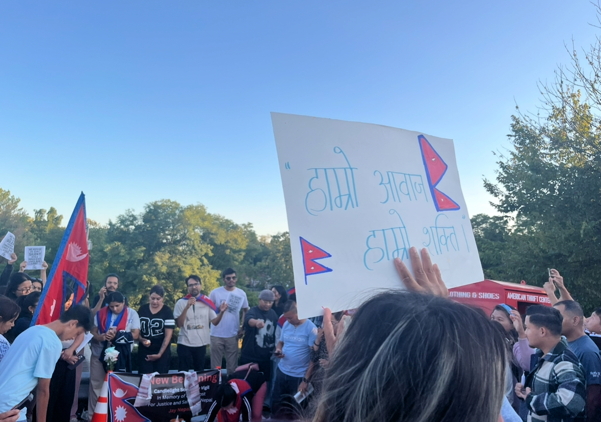 Several dozen community members participated in a vigil this Tuesday to raise awareness of the protests and violence happening in Nepal.