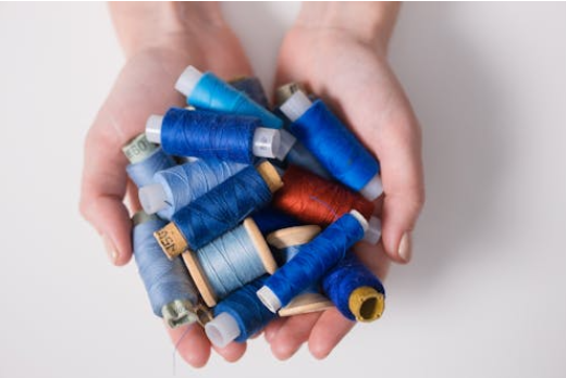 Polyester is controversial because of its affordability and impact on the environment. Image from pexels.com via Ron Lach