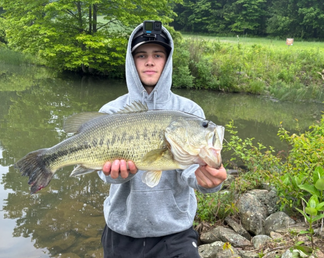 Gavin Sakely holds up his personal best large mouth bass. 