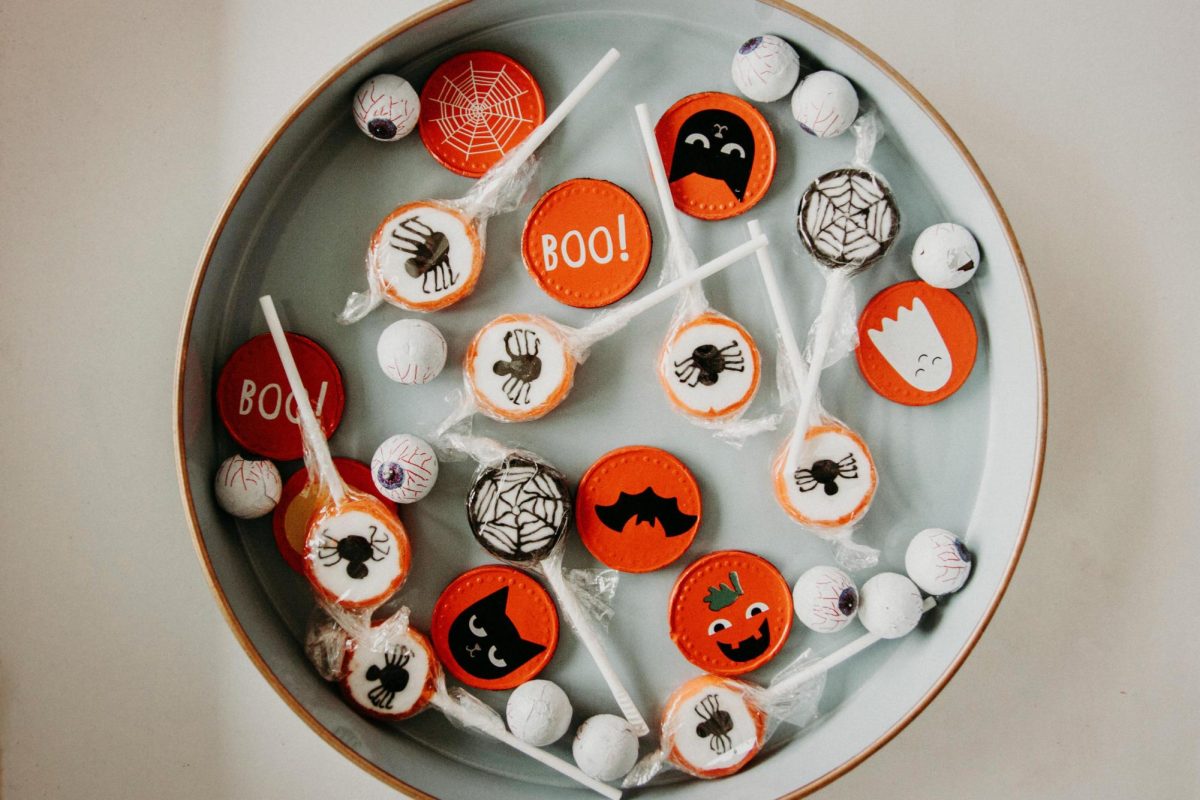 Whether or not teens should trick or treat is a common debate. Photo by Kristina Paukshtite: https://www.pexels.com/photo/halloween-candies-3095465/