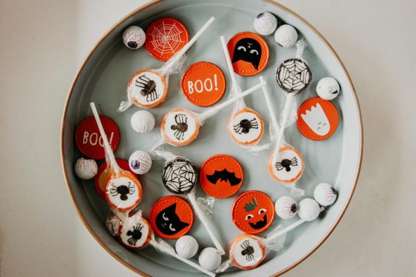 Whether or not teens should trick or treat is a common debate. Photo by Kristina Paukshtite: https://www.pexels.com/photo/halloween-candies-3095465/