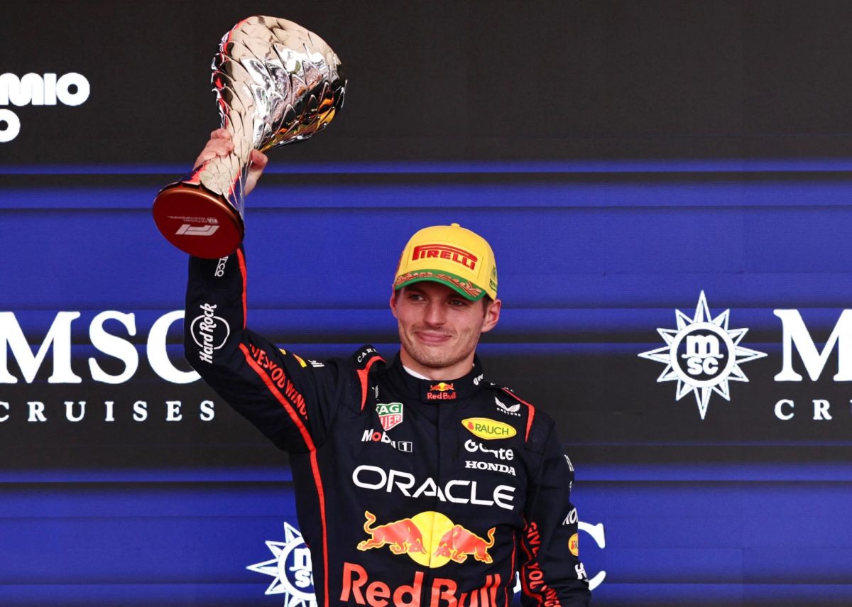 Formula One F1 - Sao Paulo Grand Prix - Autodromo Jose Carlos Pace, Sao Paulo, Brazil - November 9, 2025 Red Bull's Max Verstappen celebrates on the podium with a trophy after finishing third in the Sao Paulo Grand Prix REUTERS/Jean Carniel