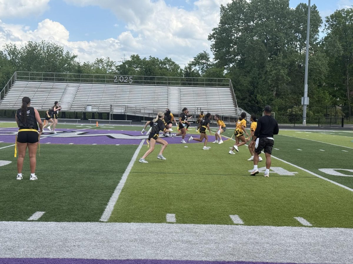 Girls play in an intramural flag football game last spring. 