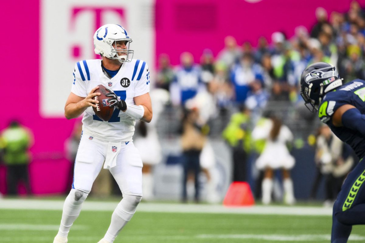 Dec 14, 2025; Seattle, Washington, USA; Indianapolis Colts quarterback Philip Rivers (17) passes against the Seattle Seahawks during the first quarter at Lumen Field. Mandatory Credit: Steven Bisig-Imagn Images