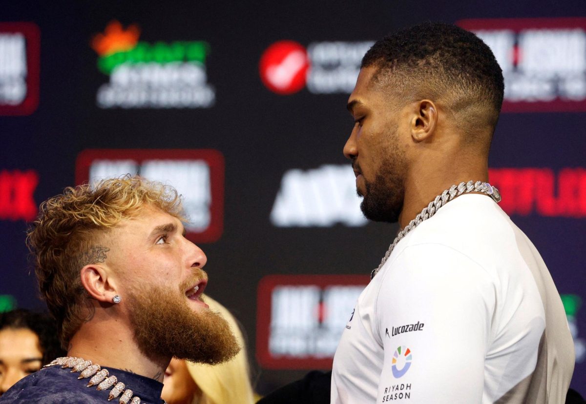 Boxing - Jake Paul v Anthony Joshua Press Conference - The Fillmore, Miami Beach, Florida, U.S. - December 17, 2025 Jake Paul and Anthony Joshua face off during the press conference REUTERS/Marco Bello