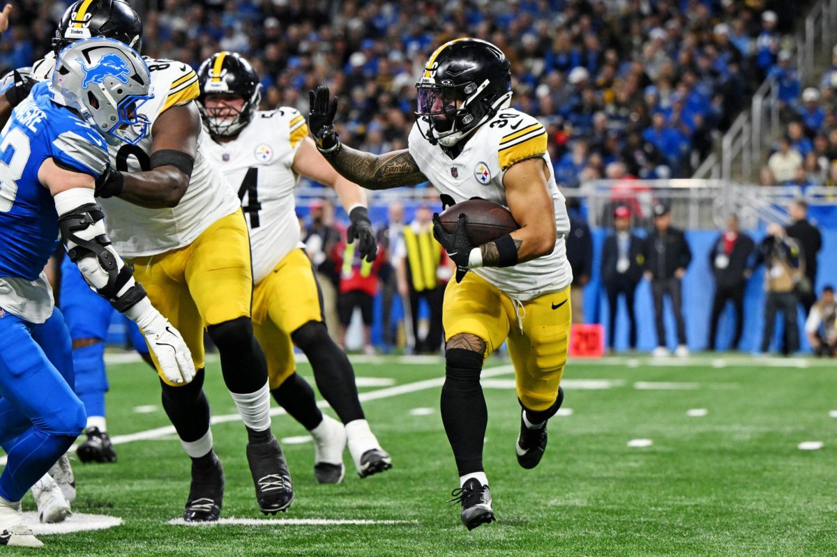 Dec 21, 2025; Detroit, Michigan, USA; Pittsburgh Steelers running back Jaylen Warren (30) runs the ball during the third quarter against the Detroit Lions at Ford Field. Mandatory Credit: Lon Horwedel-Imagn Images