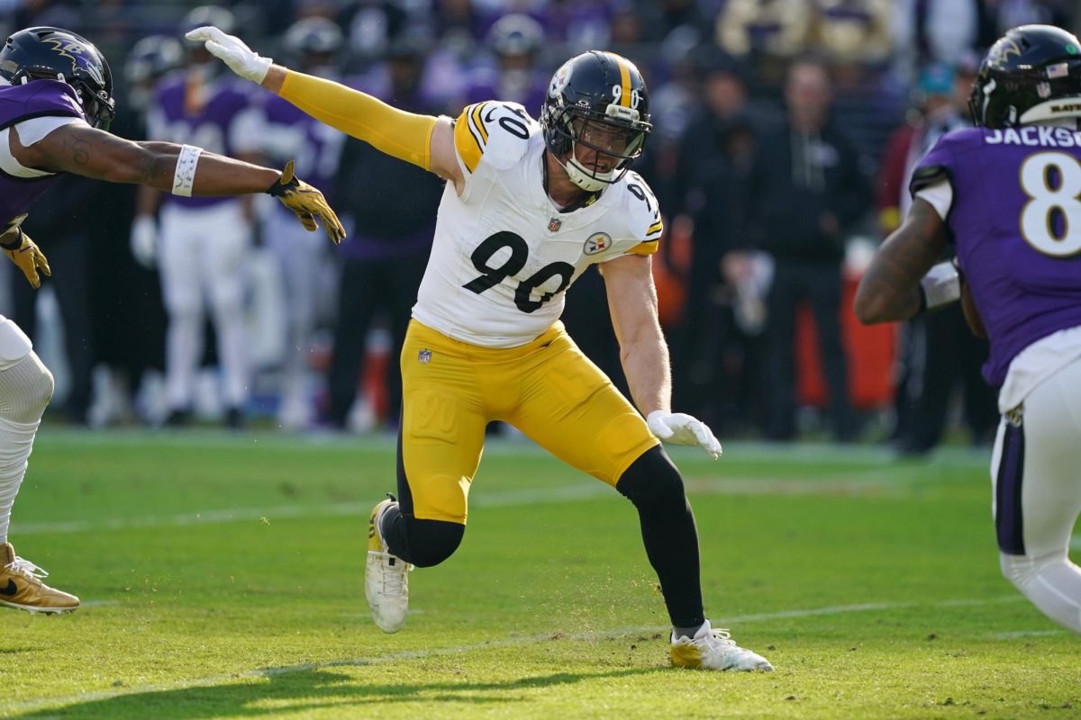 Dec 7, 2025; Baltimore, Maryland, USA; Pittsburgh Steelers linebacker T.J. Watt (90) chases down Baltimore Ravens quarterback Lamar Jackson (8) during the first half at M&T Bank Stadium. Mitch Stringer-Imagn Images