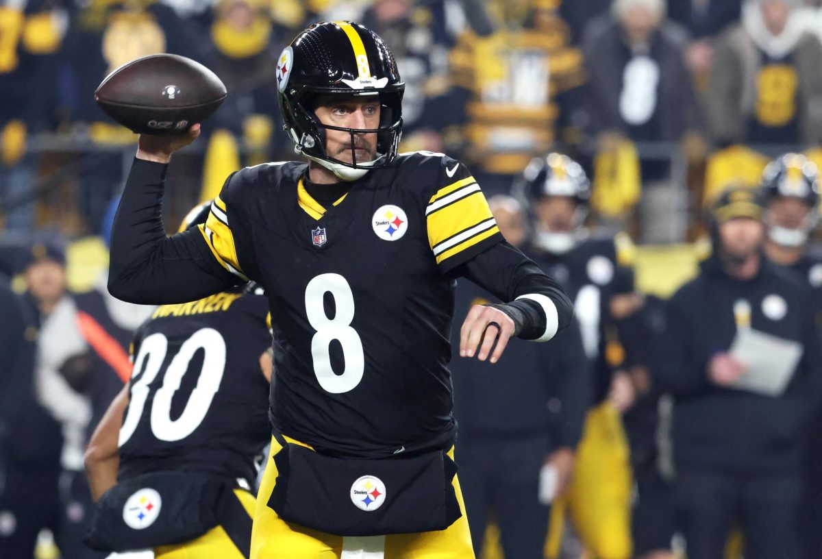 Jan 12, 2026; Pittsburgh, PA, USA; Pittsburgh Steelers quarterback Aaron Rodgers (8) throws during the first half of an AFC Wild Card Round game against the Houston Texans at Acrisure Stadium. Mandatory Credit: Charles LeClaire-Imagn Images