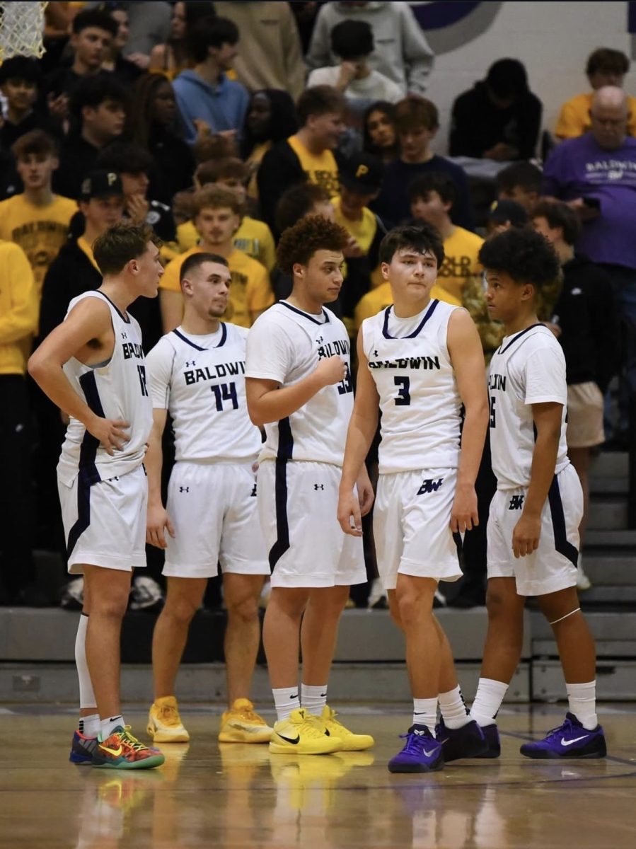 The team gathers for a quick moment to communicate future plays. 