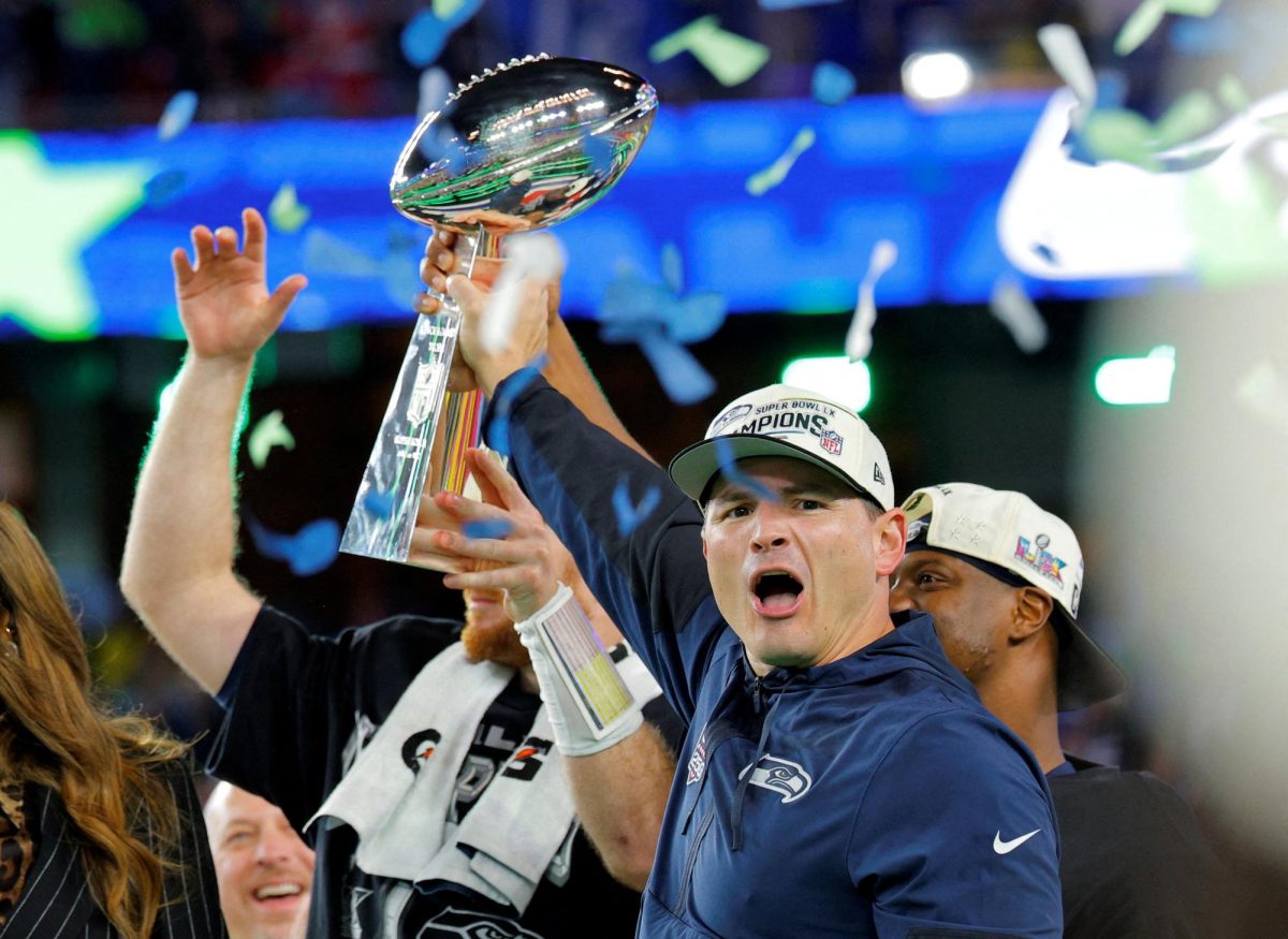 Football - NFL - Super Bowl LX - New England Patriots v Seattle Seahawks - Levi's Stadium, Santa Clara, California, United States - February 8, 2026 Seattle Seahawks head coach Mike Macdonald celebrates with the Vince Lombardi Trophy after Seattle Seahawks won the Super Bowl LX. REUTERS/Mike Blake