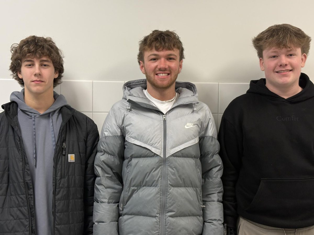 Mack Dempsey (from left), Nate Buys, and Jacob Kaercher have been named to the ice hockey all-star team.