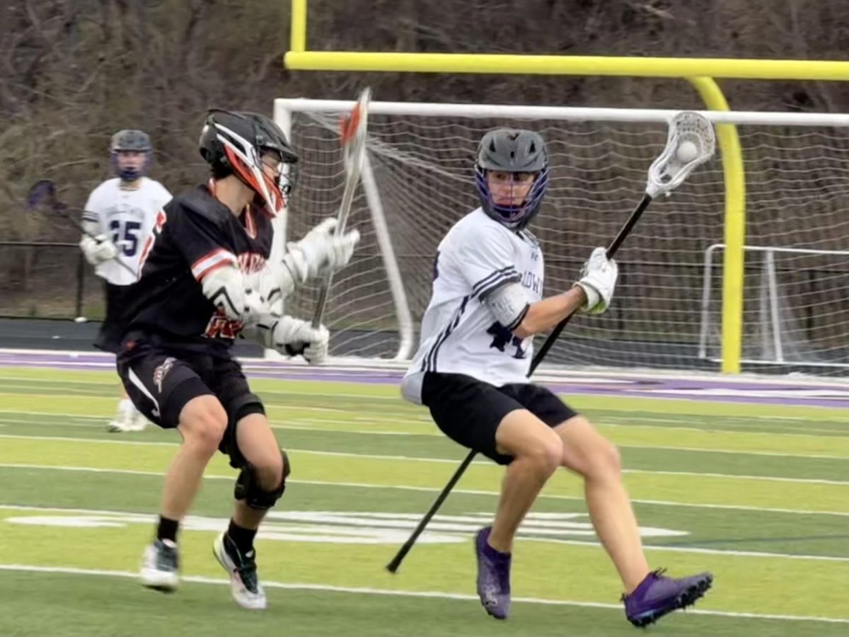A player from Greater Latrobe defends junior Kaden Kicinski while he tries to pass down field.
