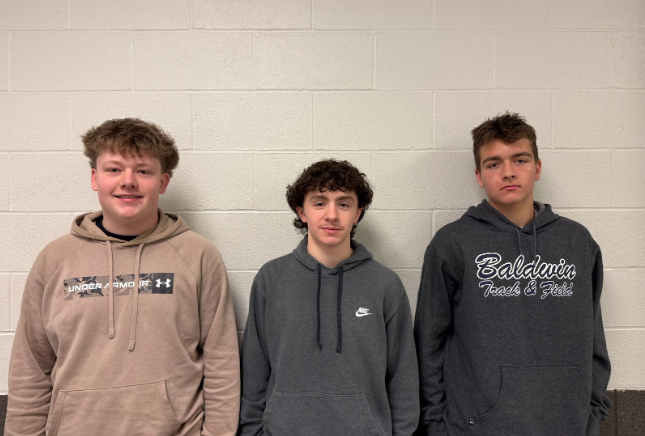Jacob Kaercher (from left), Austin Klein, and Timothy Bush will be returning to help lead the ice hockey team next year.