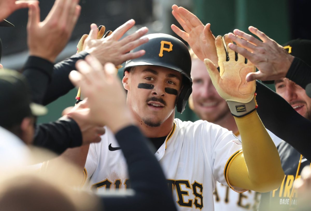 Apr 3, 2026; Pittsburgh, Pennsylvania, USA;  Pittsburgh Pirates shortstop Konnor Griffin (6) high-fives in the dugout after scoring his first major league run in his debut against the Baltimore Orioles during the second inning at PNC Park. Mandatory Credit: Charles LeClaire-Imagn Images