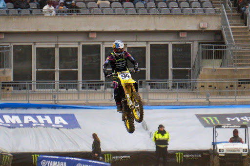 Ken Roczen jumps a triple jump inside Acrisure Stadium in April 2025.
