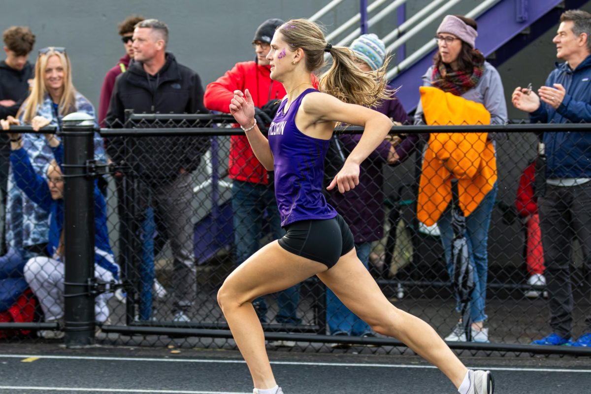 Senior Jules Ott runs during the 400 meter dash at the Baldwin Invitational.