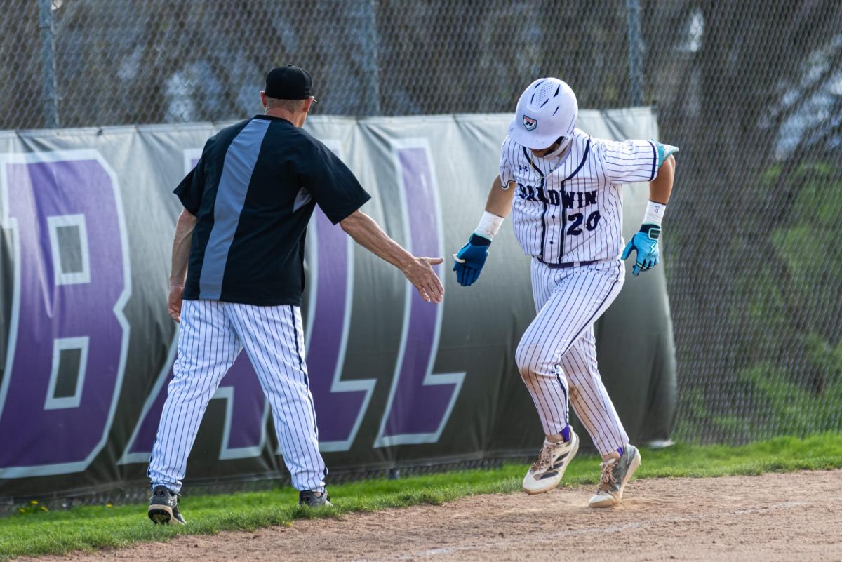 Junior Aiden Robinson celebrates his home run in a Apr. 13 game against Gateway.