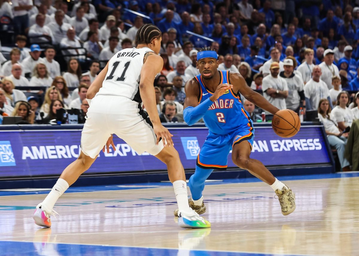 May 20, 2026; Oklahoma City, Oklahoma, USA; Oklahoma City Thunder guard Shai Gilgeous-Alexander (2) looks to pass as San Antonio Spurs forward Carter Bryant (11) defends during the third quarter during game two of the western conference finals for the 2026 NBA playoffs at Paycom Center. Mandatory Credit: Brett Rojo-Imagn Images