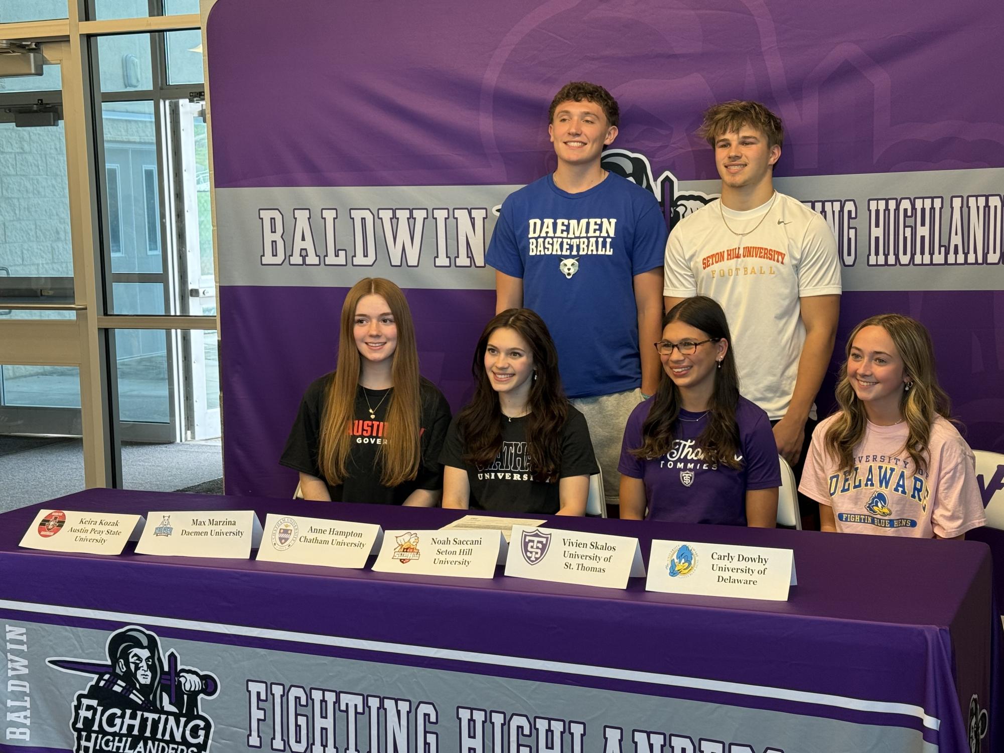 Senior athletes sign letters of intent for college sports.