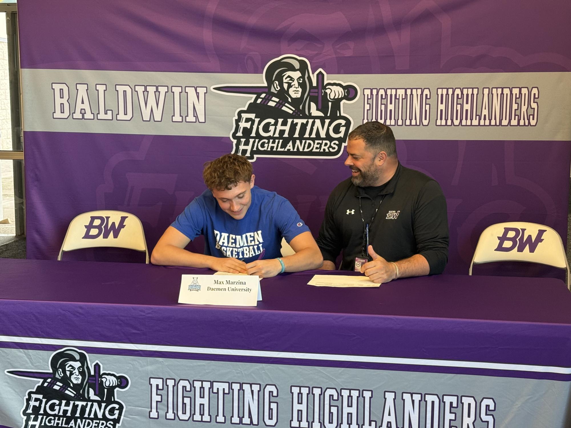 Senior Max Marzina signs to play basketball at Daemen University.