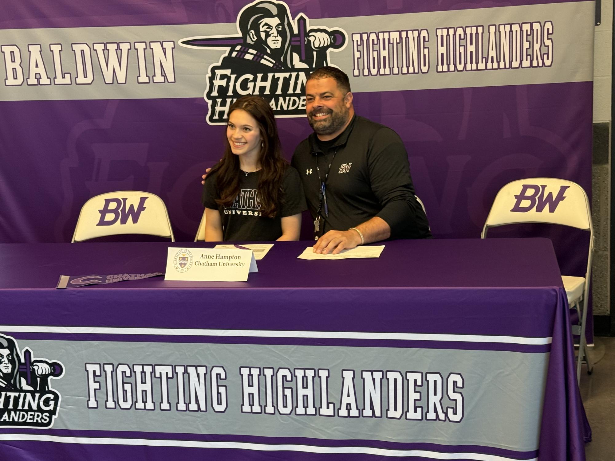 Senior Anne Hampton signs to cheer at Chatham University.