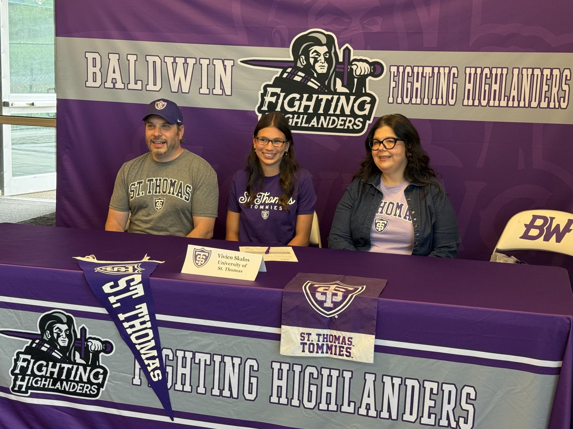 Senior Vivien Skalos signs to cheer at the University of St. Thomas.