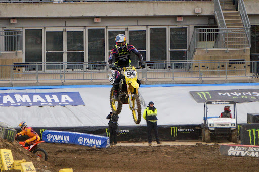 Ken Roczen jumps a rhythm section inside Acrisure Stadium in April 2025.