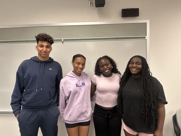 Christian Jones, Layla Spearman, Naima Juma, and Bethel Emmanuel are a part of the Students For Belonging board. 